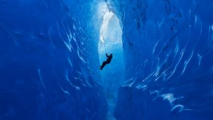 A climber rappels into an ice cave on the Mendenhall Glacier, Alaska, USA 4796d970d101c622997fb3fe2276602e