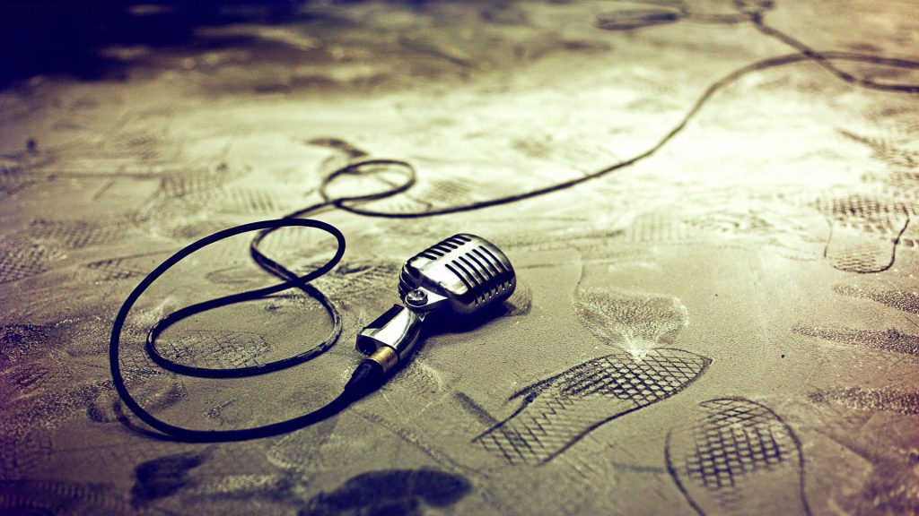 Retro microphone on floor with footprints