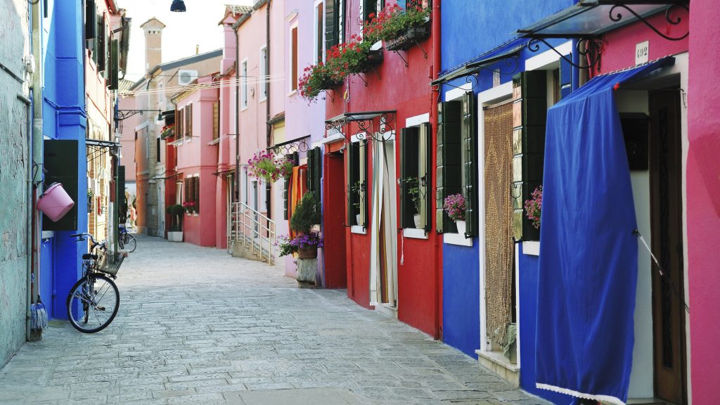Colorful buildings in Burano island street, Venice, Italy