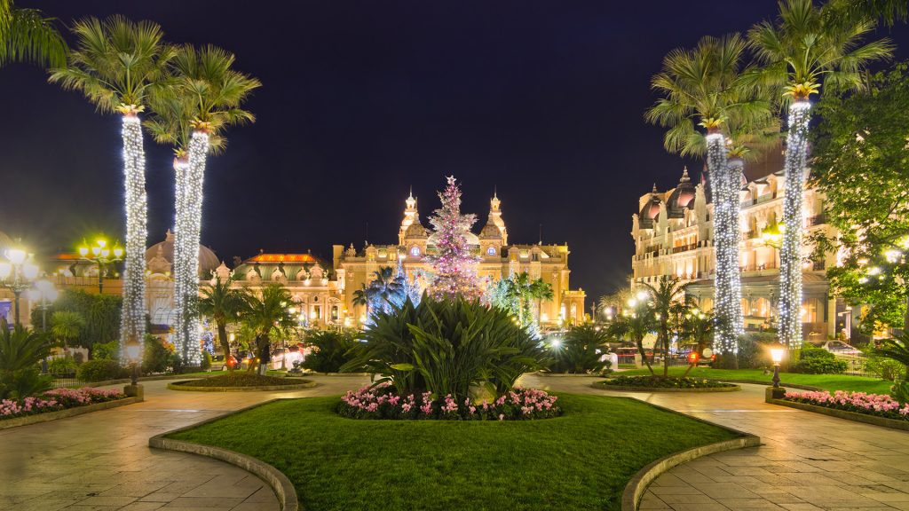 Christmas tree in front of the palace of casino of Monaco at dusk, Montecarlo, France