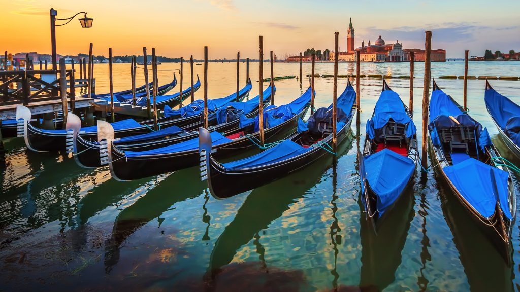 Venice with famous gondolas at sunrise, Italy