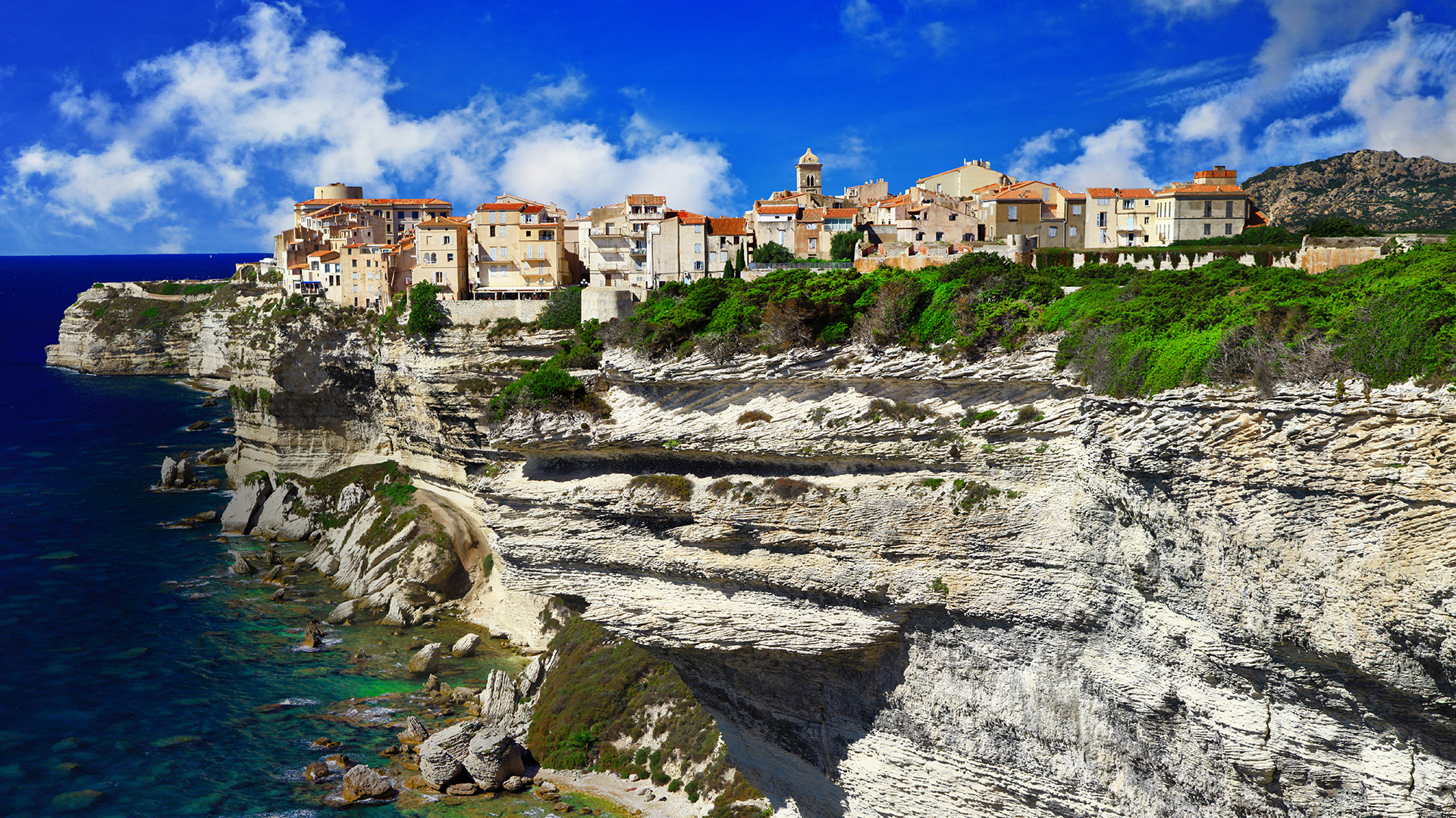 Upper town of Bonifacio on a chalkstone sea cliff, Corsica, France ...