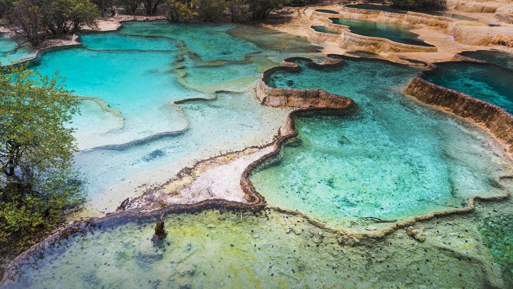 Colourful pools formed by calcite deposits, Huanglong, Sichuan province, China