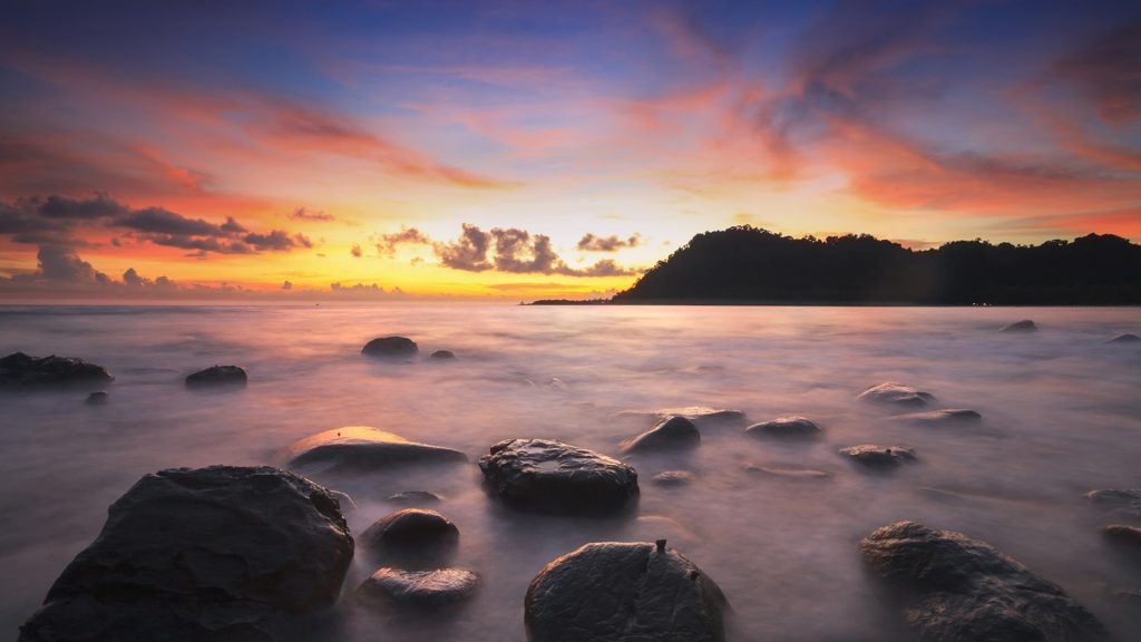 Sunset and sea wave at Koh Kood (Ko Kut) Island, Thailand