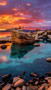 Candy colored skies sunset at shoreline of Lake Tahoe, Nevada, USA ...