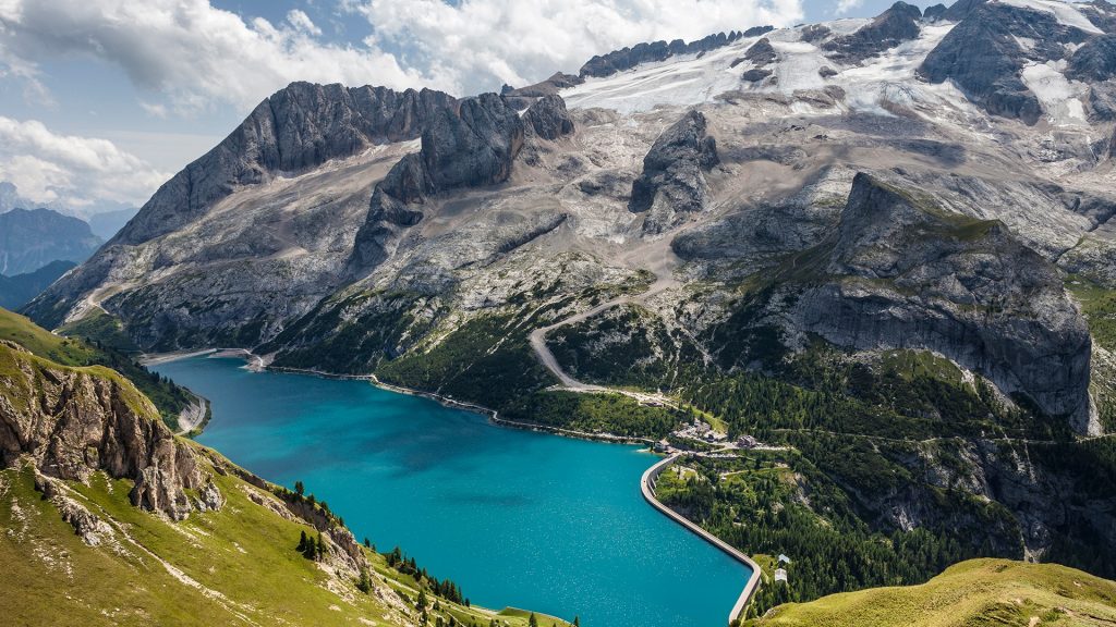 Fedaia Pass with lake at the foot of Marmolada, Dolomites, Italy
