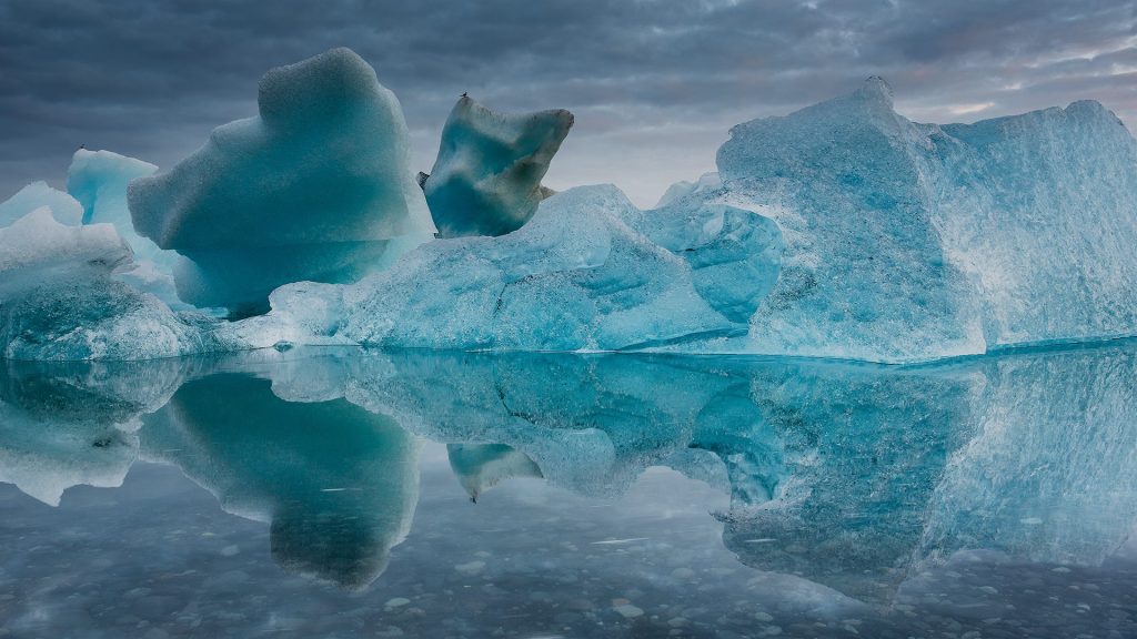 Icebergs melting in the midsummer night at Jökulsárlón, Iceland