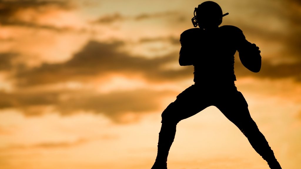 Silhouette shot of football player