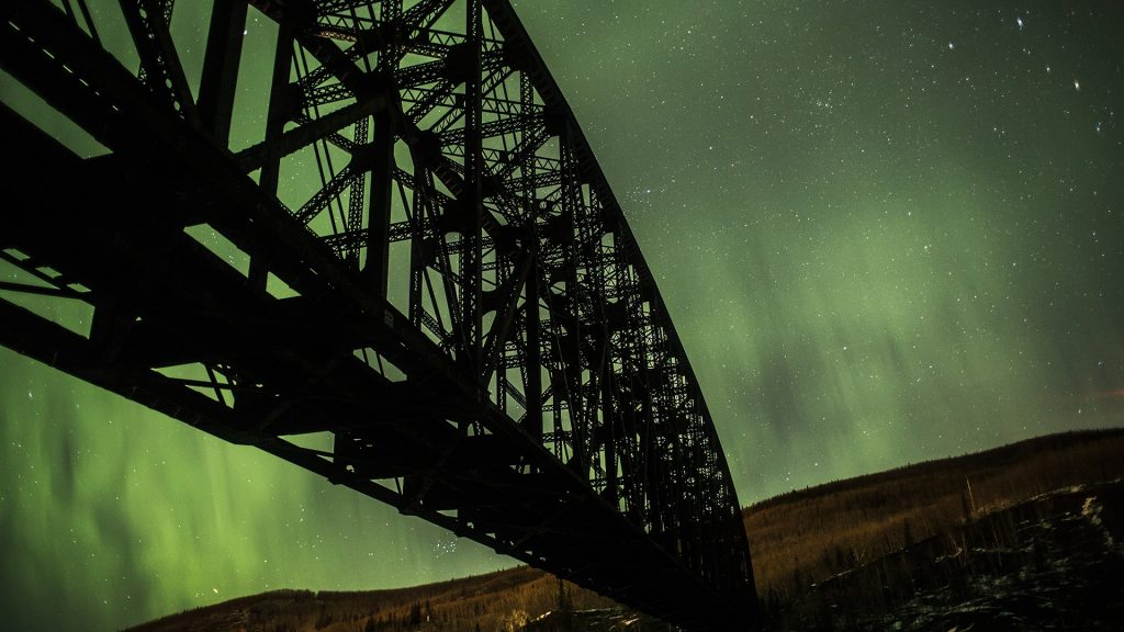 Mears Memorial bridge and Northern lights, Alaska, USA