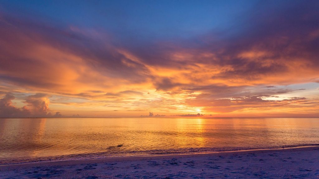Naples beach amazing sunset and calm ocean, Florida, USA