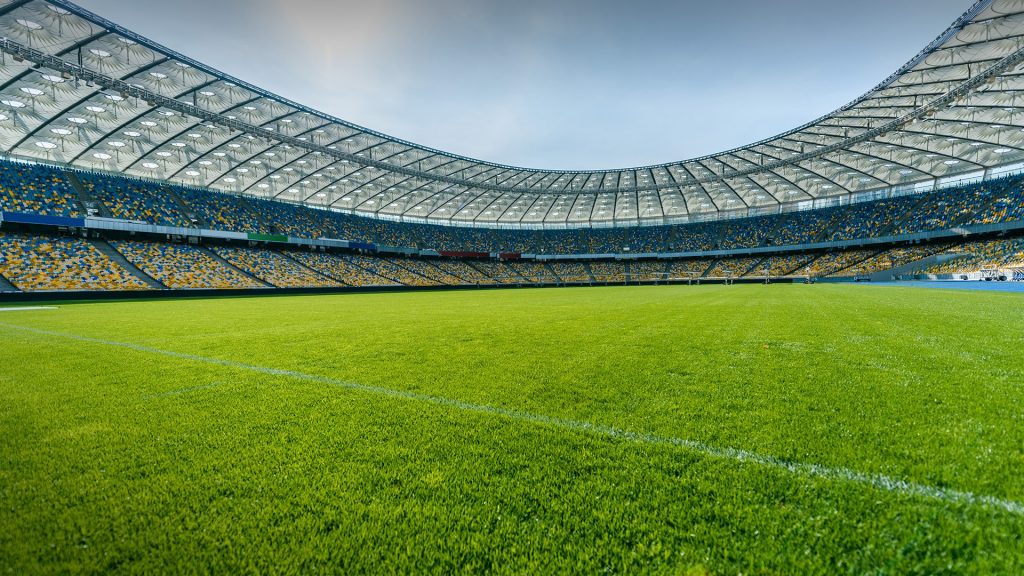 Panoramic view of soccer field stadium and stadium seats