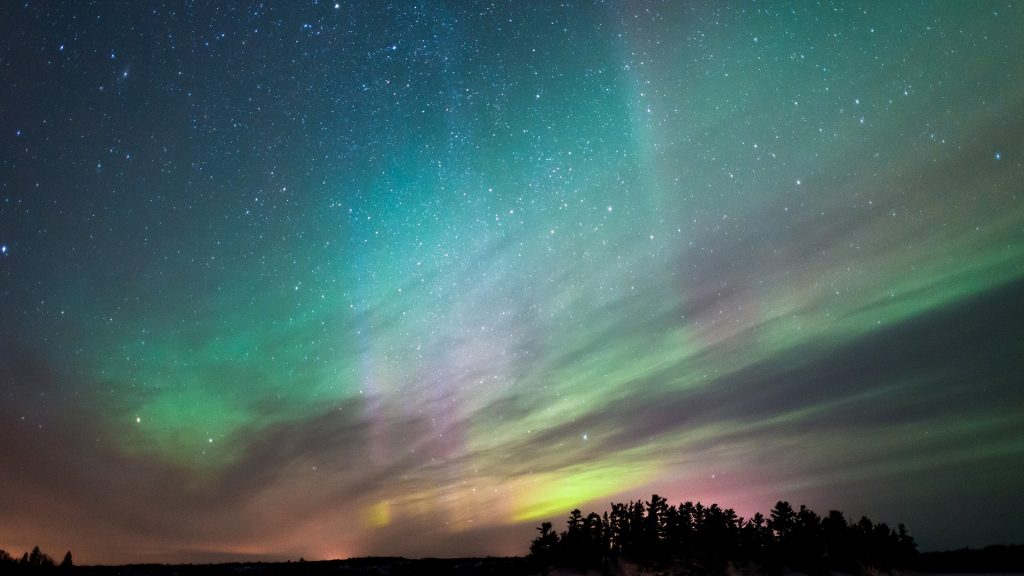 Northern lights dancing across winter sky, Canada