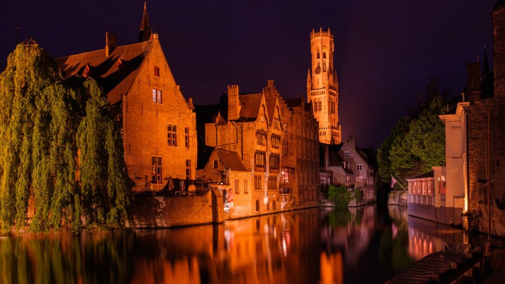 Huidenvetters plein, Dijver river canal and Belfort (Belfry) tower, Bruges, Belgium