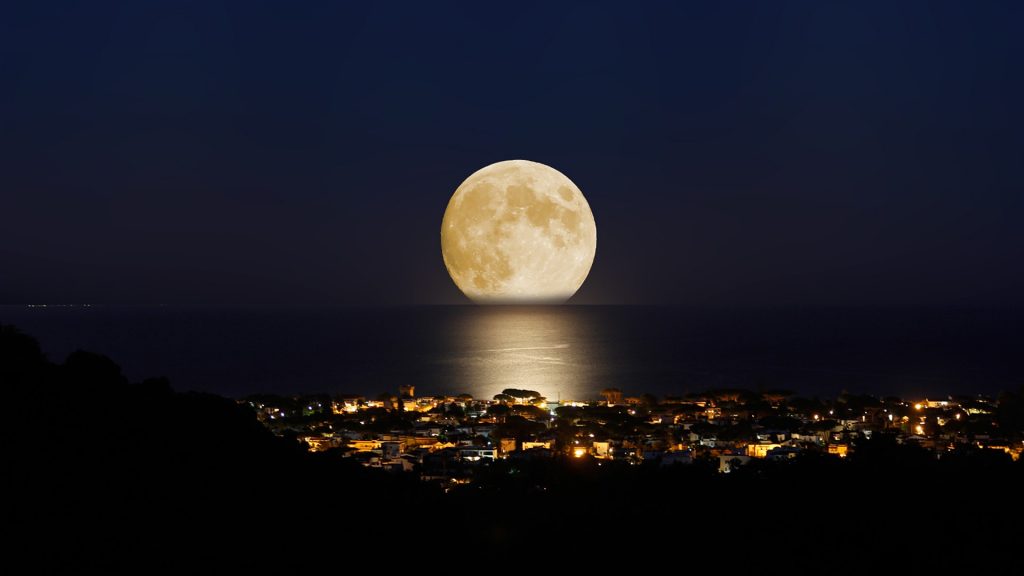 Summer moon and San Felice Circeo at night, Latina, Italy