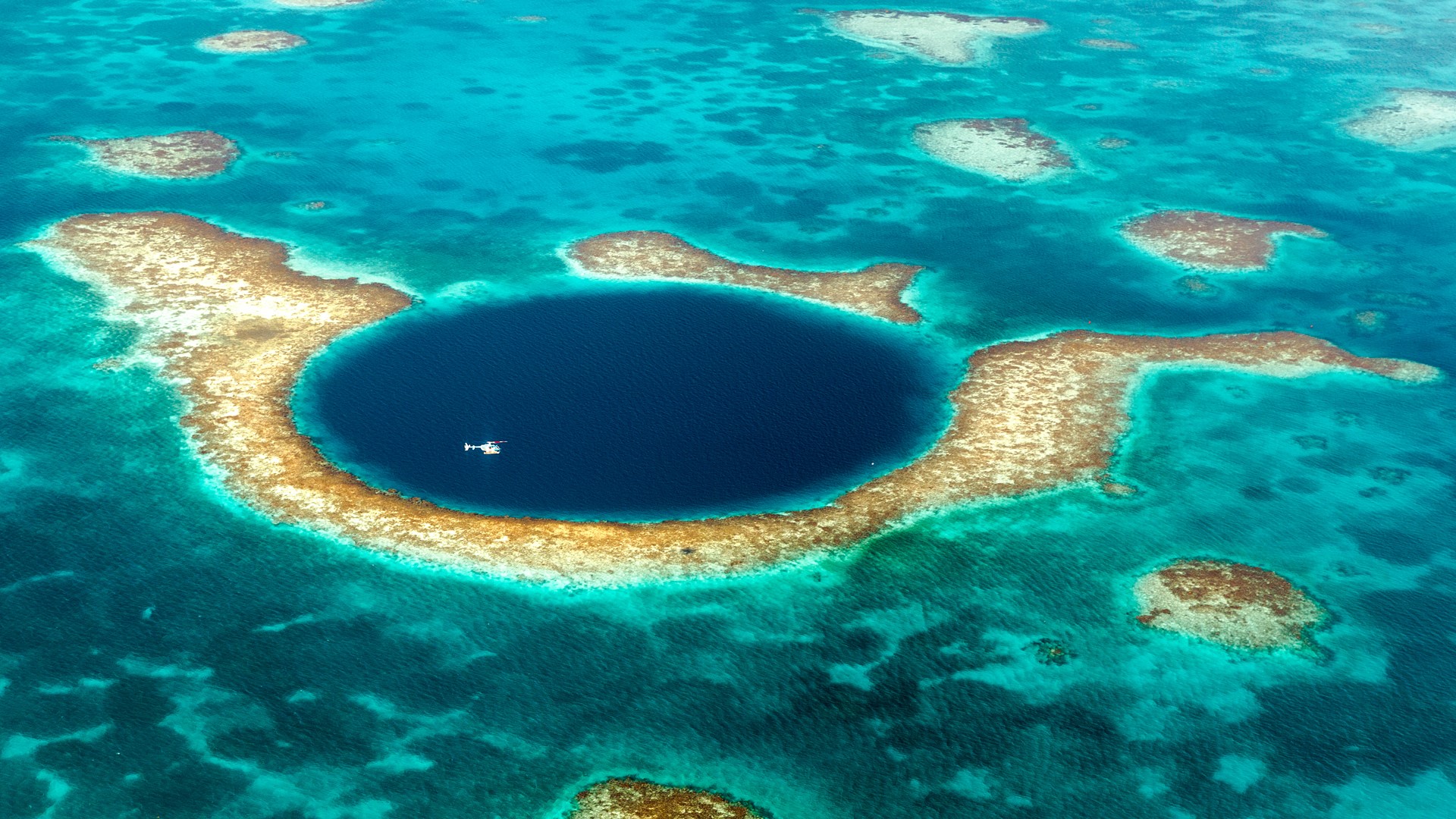 Helicopter above the Great Blue Hole, Belize Barrier Reef | Windows ...