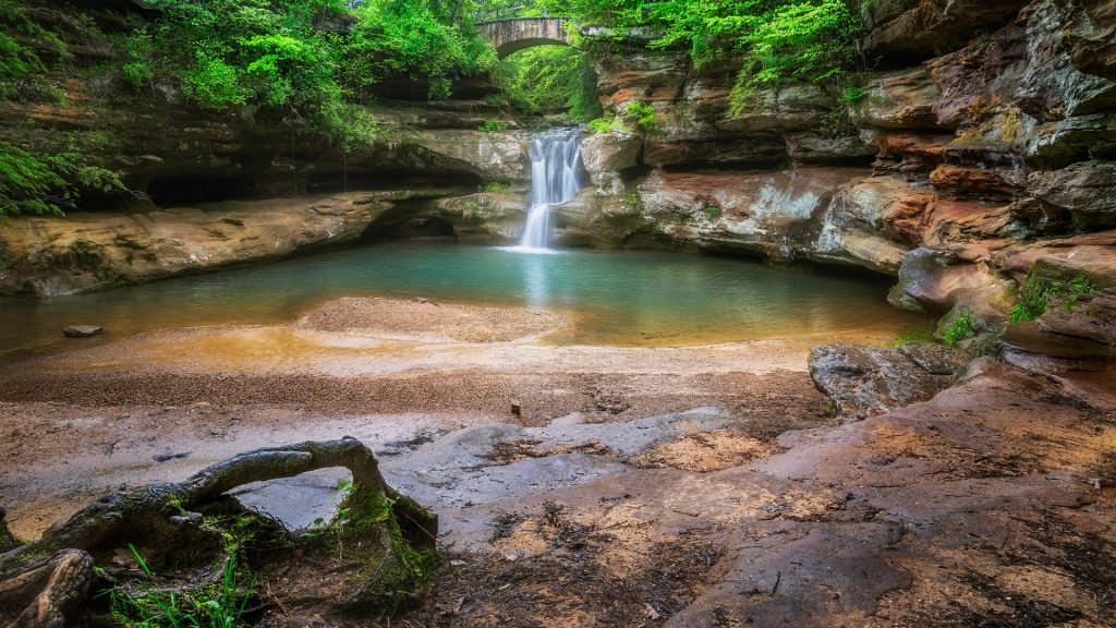 Waterfall with a stone bridge across the top, Hocking Hills State Park, Ohio, USA