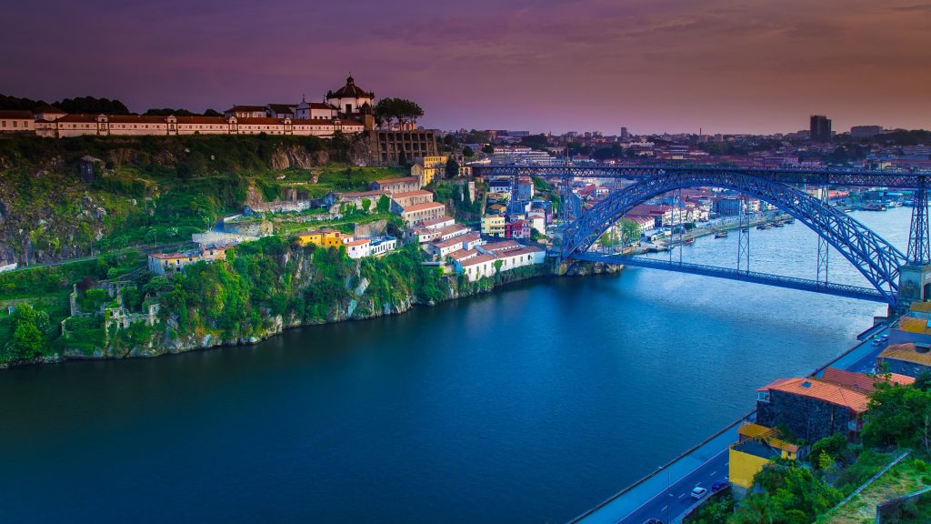 Old Town skyline across the Douro River and The Luis Bridge, Porto sunset, Portugal