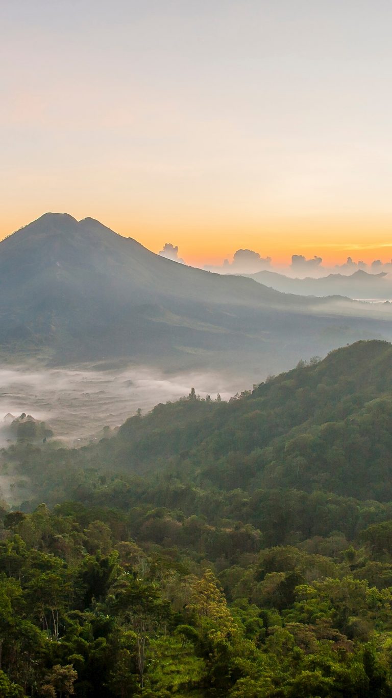 Hilltops over morning fog  in remote landscape Kintamani 