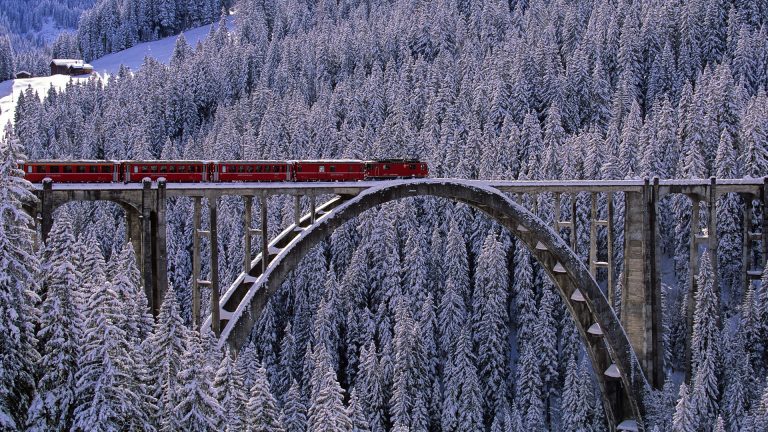 Arosa Express train across the bridge near Langwies in Arosa valley ...