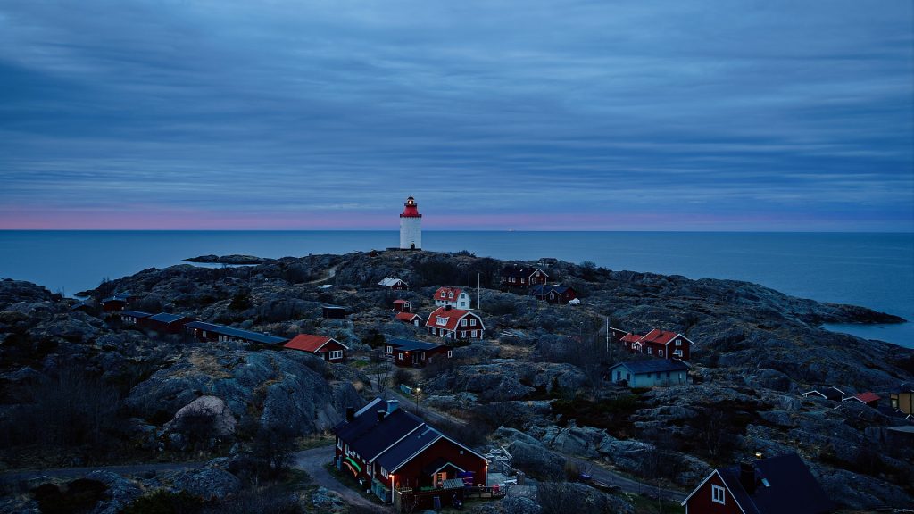 Lighthouse by sea against sky at sunset, Landsort, Öja island, Stockholm archipelago, Sweden