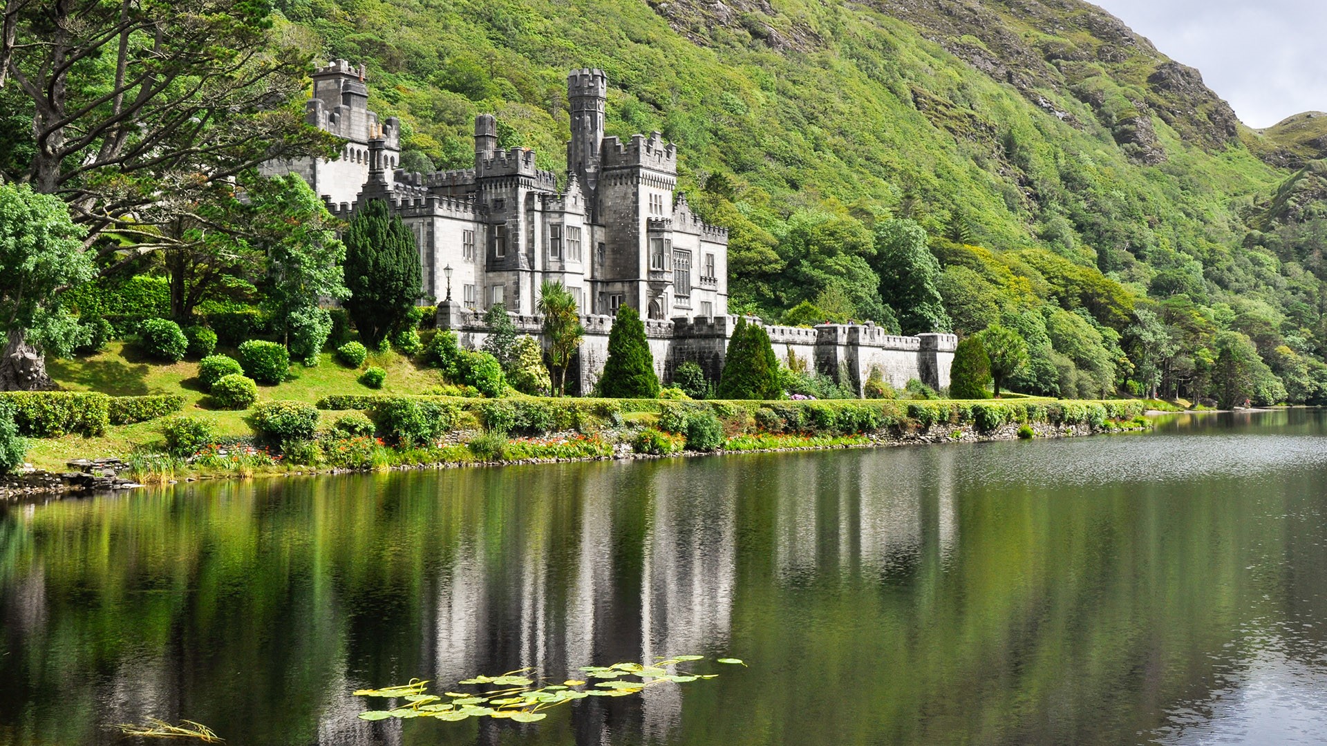 View From Water At Kylemore Abbey Near Trees Connemara County Galway 