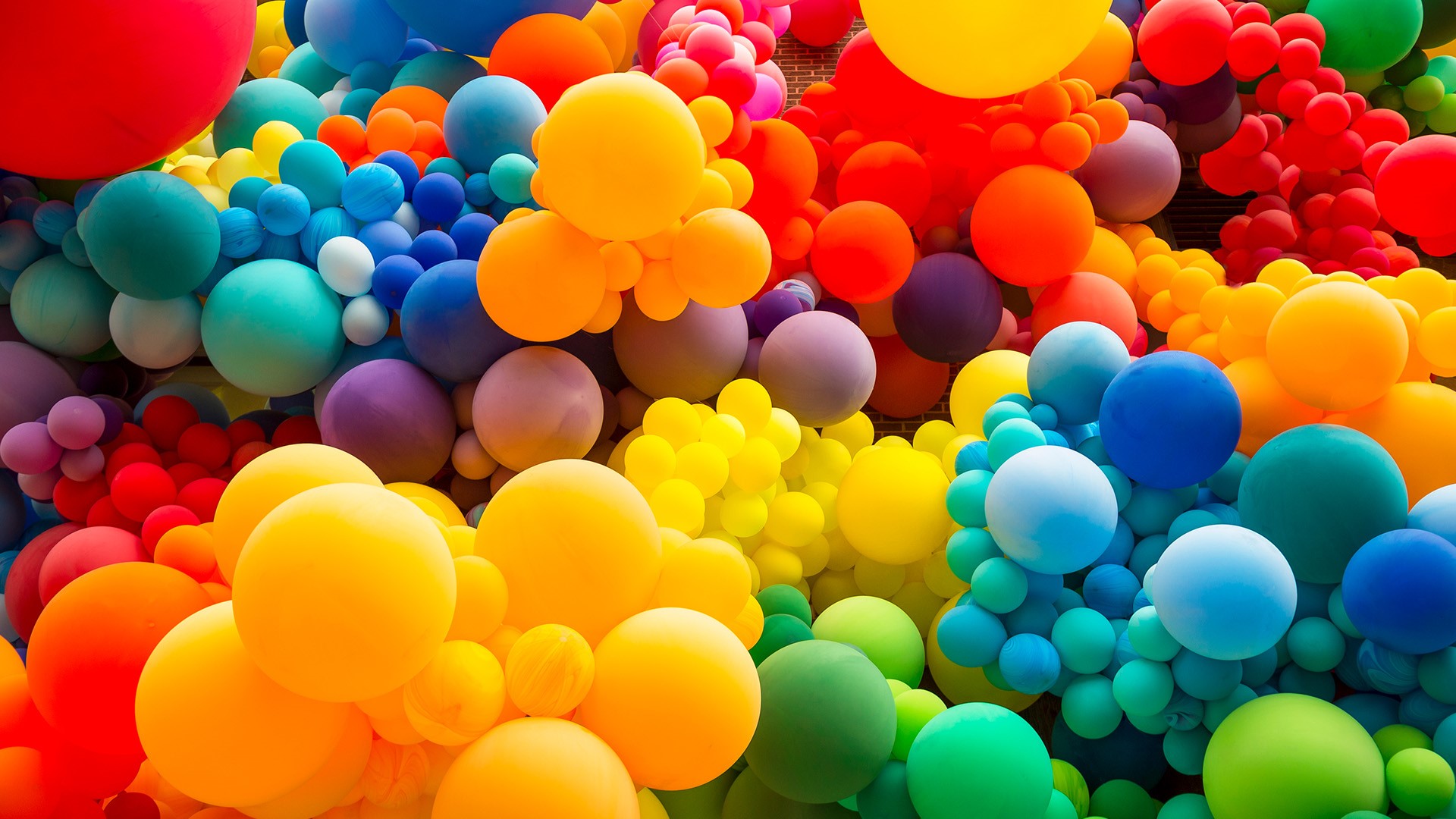 Bright abstract background of jumble of rainbow colored balloons | Windows  Spotlight Images