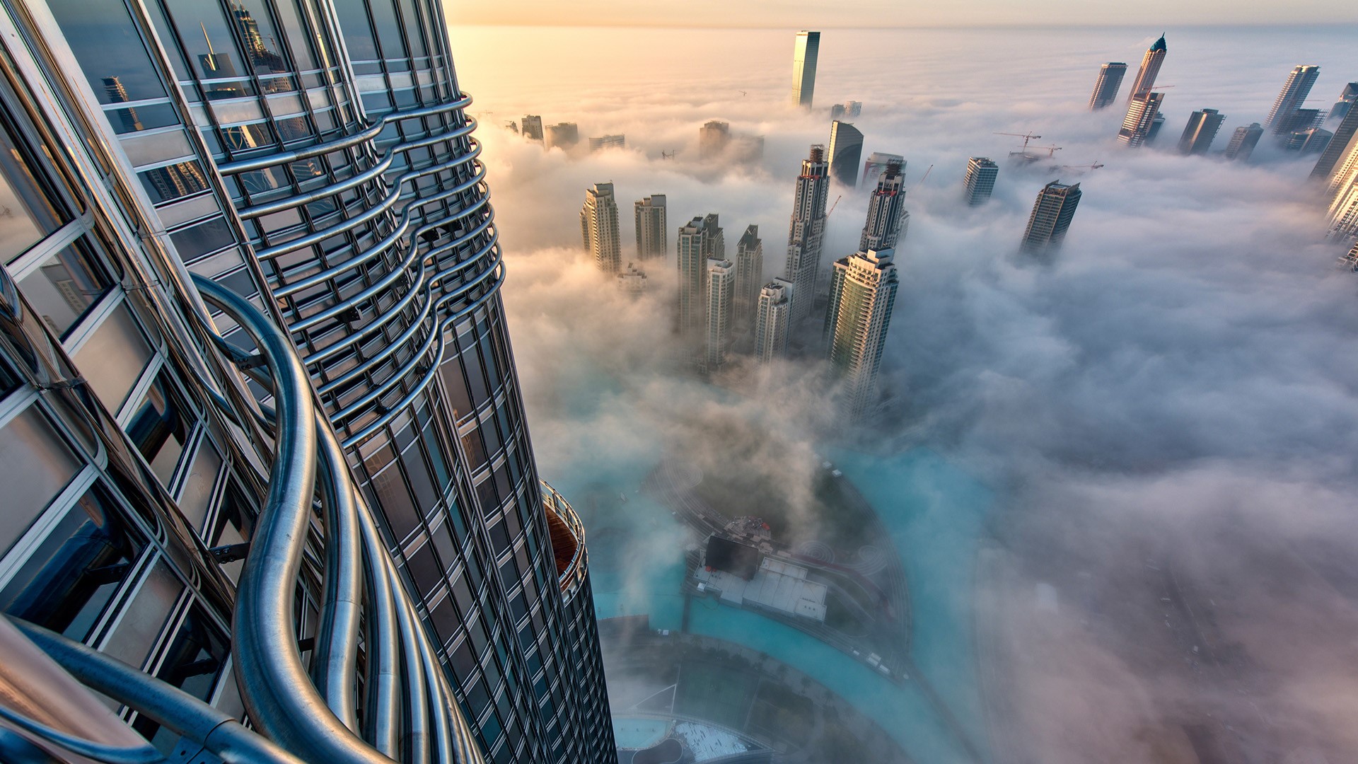Aerial view of cityscape with skyscrapers above the clouds in Dubai, UAE | Windows 10 Spotlight