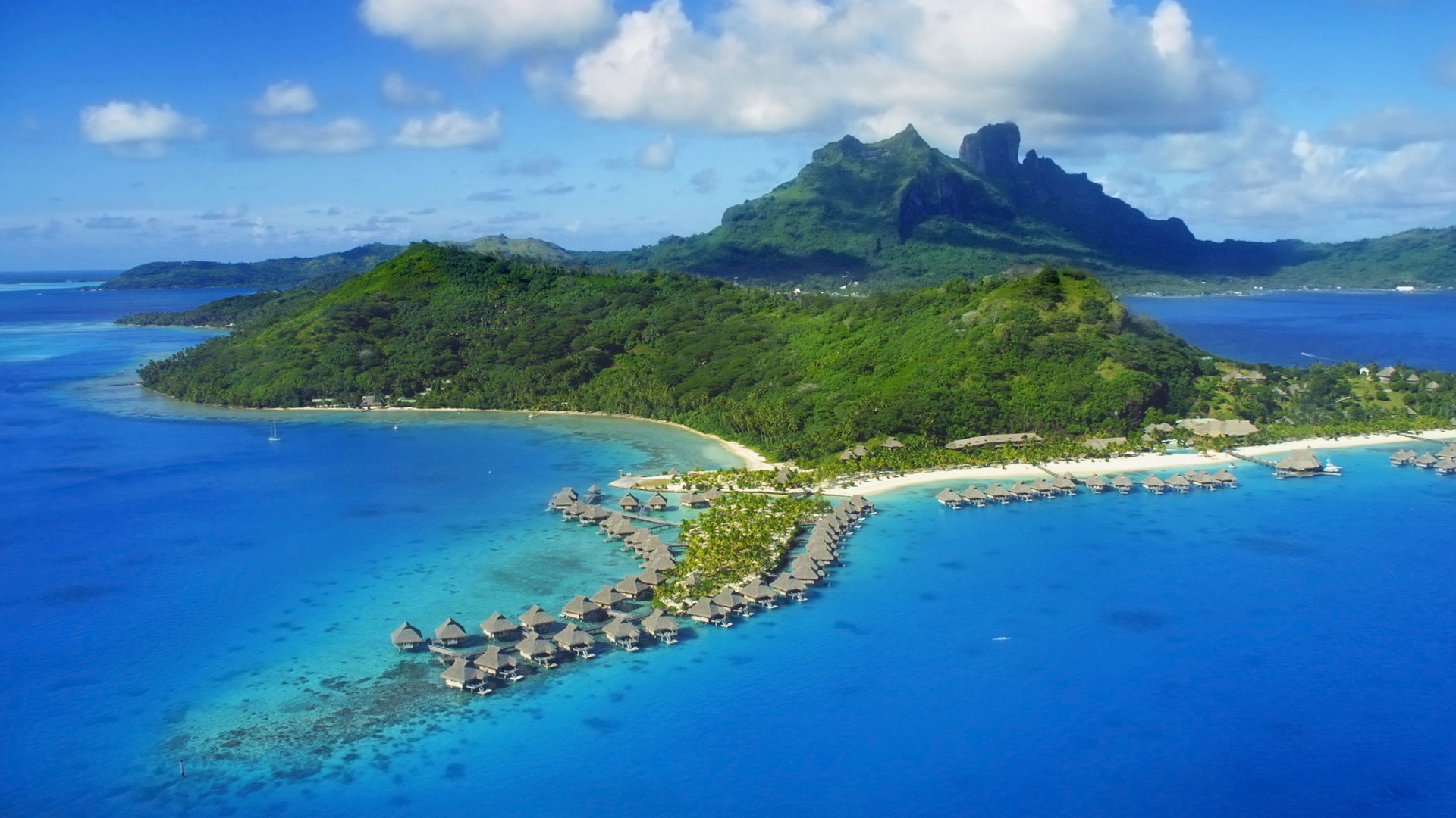 Aerial view of Bora Bora with Mount Otemanu and coral reef, French ...