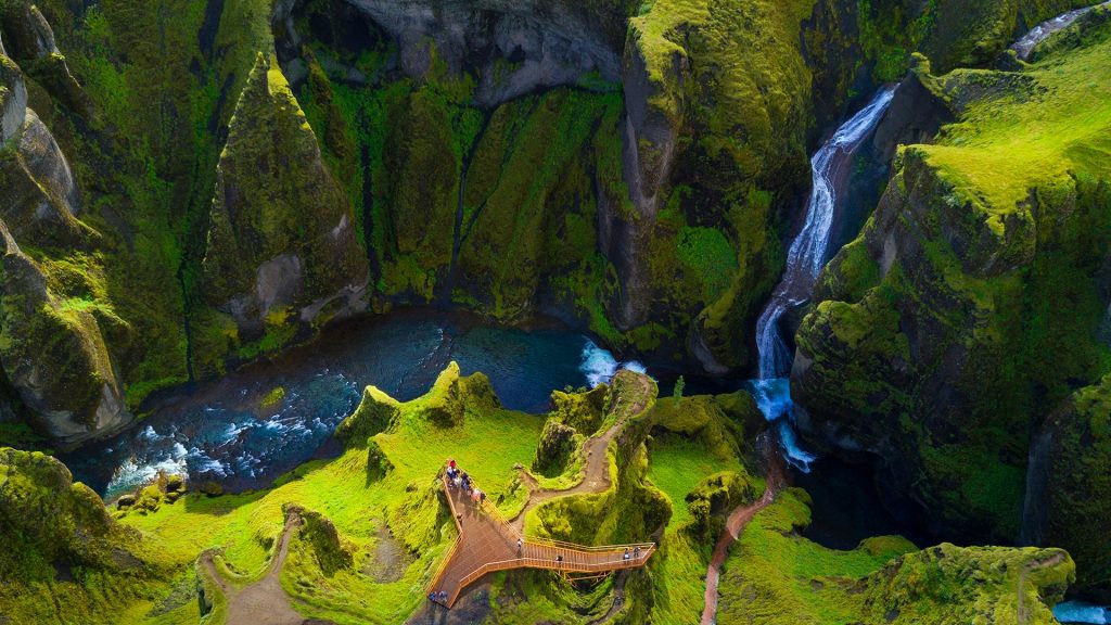 Waterfall at Fjaðrárgljúfur canyon in summer view from drone, Iceland