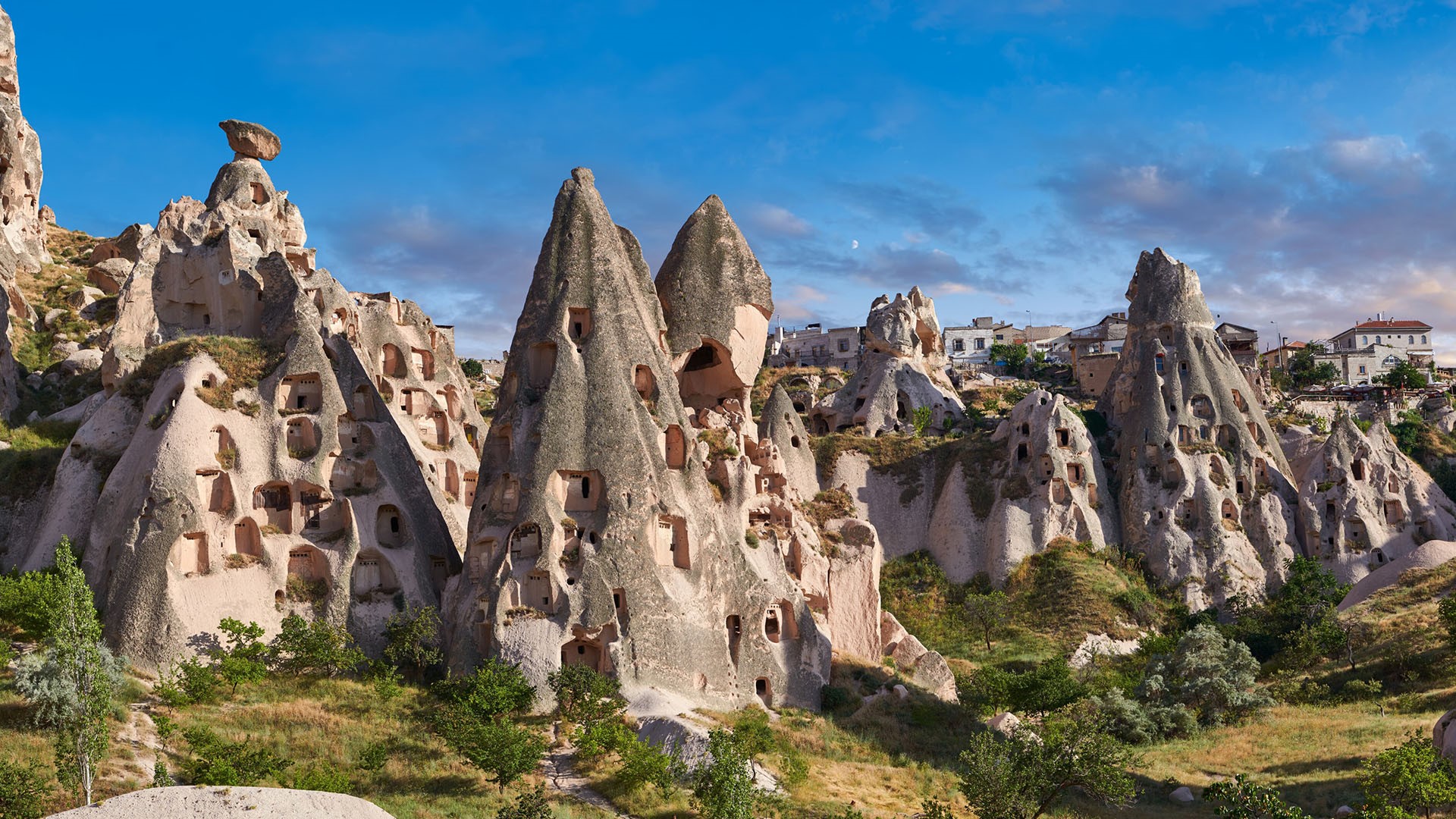 Carved houses in rock formations in Uçhisar near Goreme, Cappadocia ...