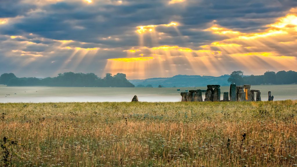Cloudy sunrise over Stonehenge, Amesbury, Wiltshire, England, UK