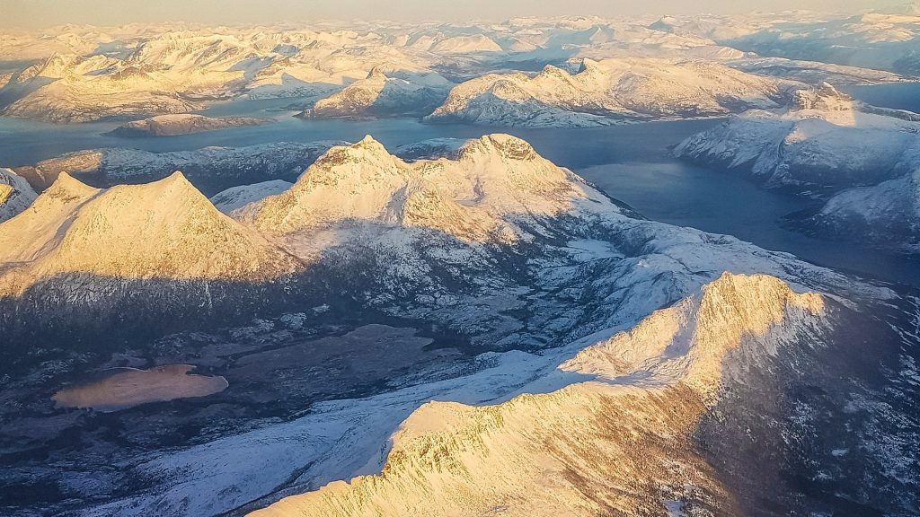 Aerial view at sunset on Norwegian Mountains, fjords and lake, Troms, Norway