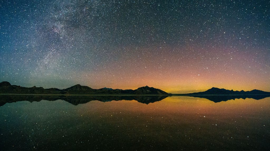 Reflecting pool of mountain range and Milky Way, Bonneville, Utah, USA