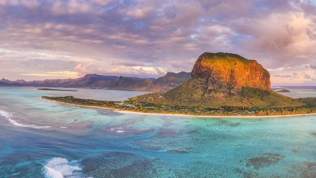 Sunset over Le Morne Brabant peninsula and coral reef, Mauritius