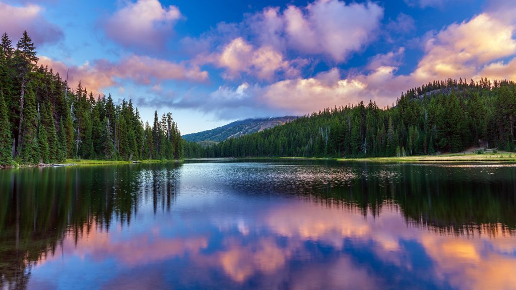 Mount Bachelor during sunset reflecting in waters of Todd Lake, Bend, Oregon, USA