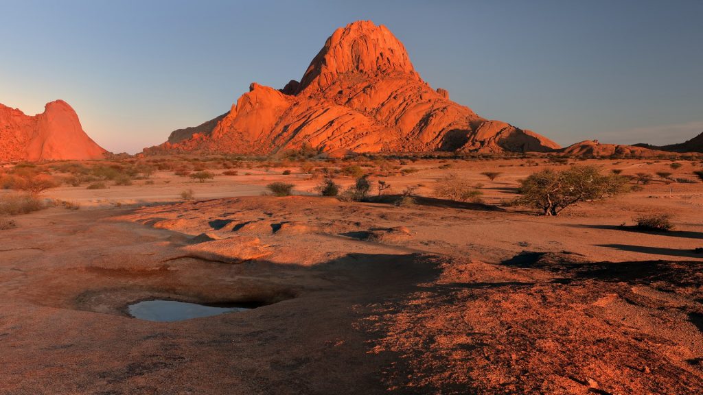 Namib Desert landscape of red granite rocks in Spitzkoppe area at sunrise, Namibia