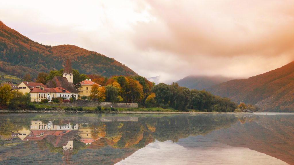 Quaint town on the shore of the Danube River in fall, Austria