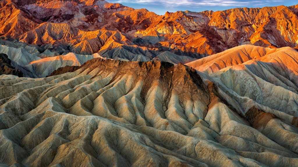 Eroded mountain ridges in the sunset at Zabriskie Point, Death Valley, California, USA