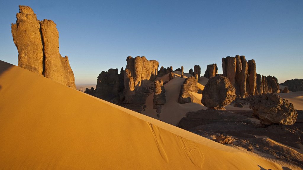 Rock formations and dunes at Tin Akachaker desert (Citadel), Hoggar, Ahaggar Mountains, Algeria