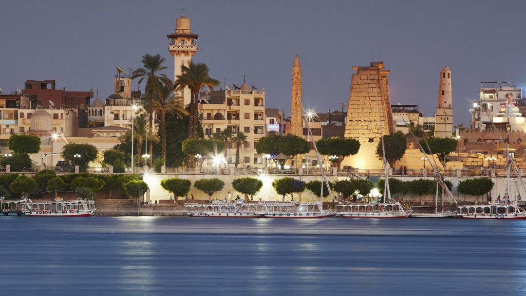 View of town and Luxor Temple across the Nile River, Thebes, Egypt
