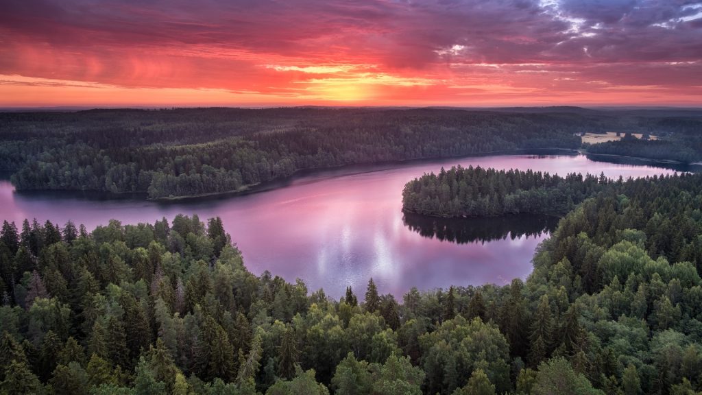 Landscape with sunrise and lake at summer in national park Aulanko, Hämeenlinna, Finland