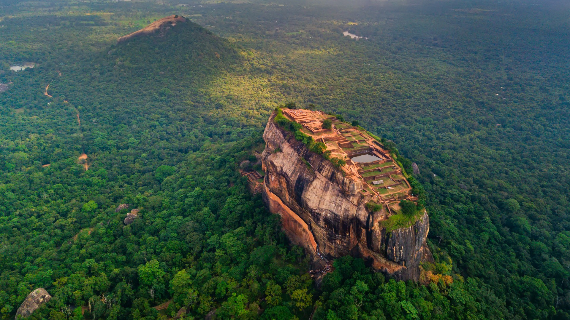 Aerial view of Sigiriya rock fortress at misty morning, Matale District,  Sri Lanka | Windows 10 Spotlight Images