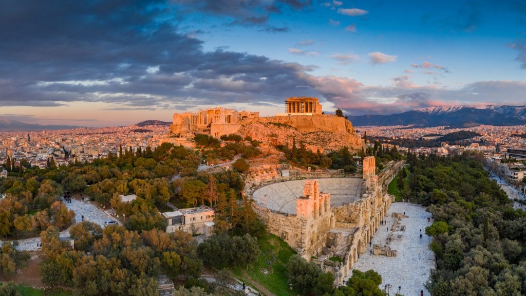 Aerial view of Acropolis of Athens, the Temple of Athena Nike, Parthenon, Hekatompedon Temple, Sanctuary of Zeus Polieus, Odeon of Herodes Atticus, Erechtheion at sunset, Greece
