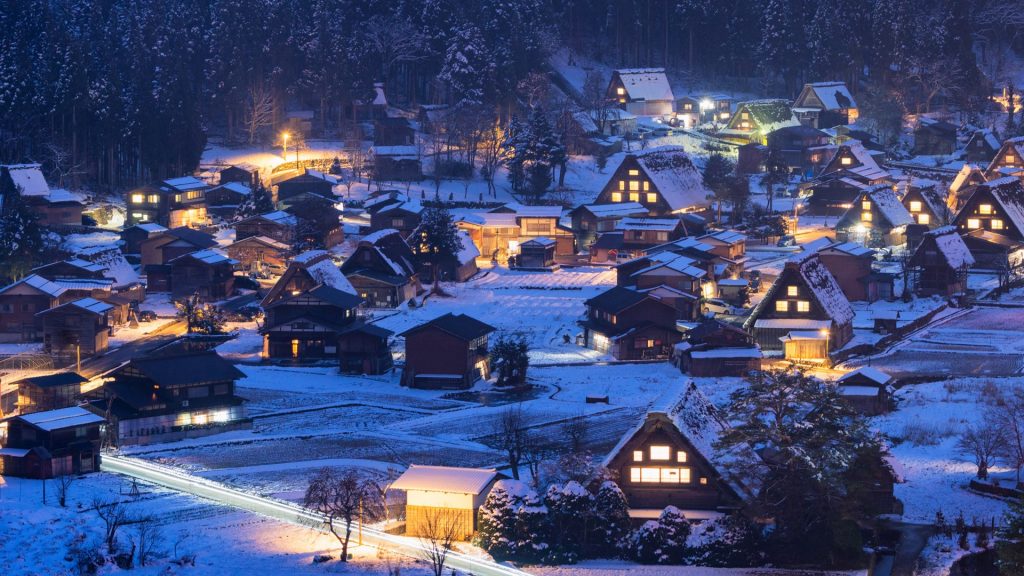 Illuminated Shirakawa-gō traditional village at winter dusk, Gifu, Japan