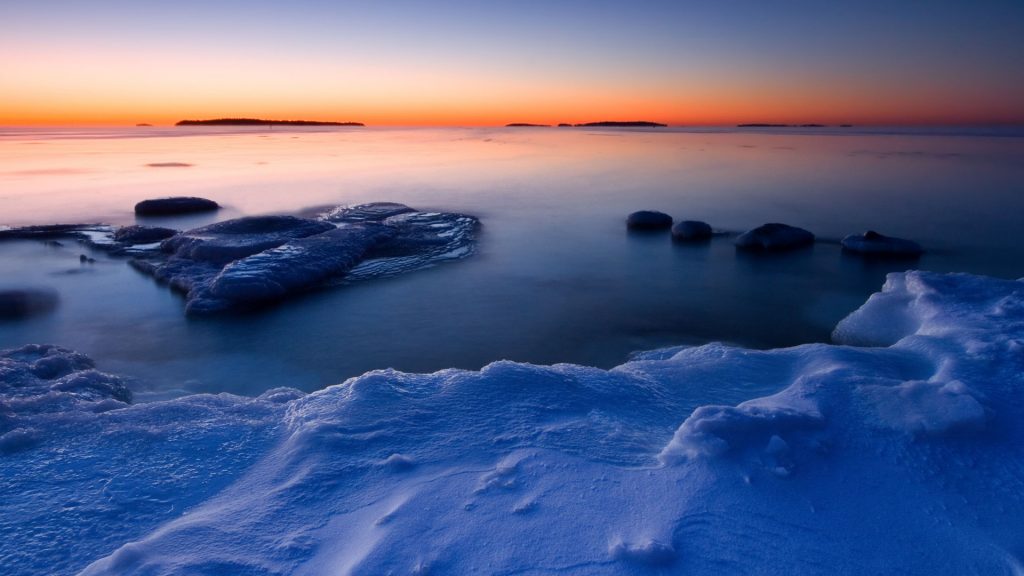 Sunrise in cold morning at coast of Uutela, Helsinki, Finland