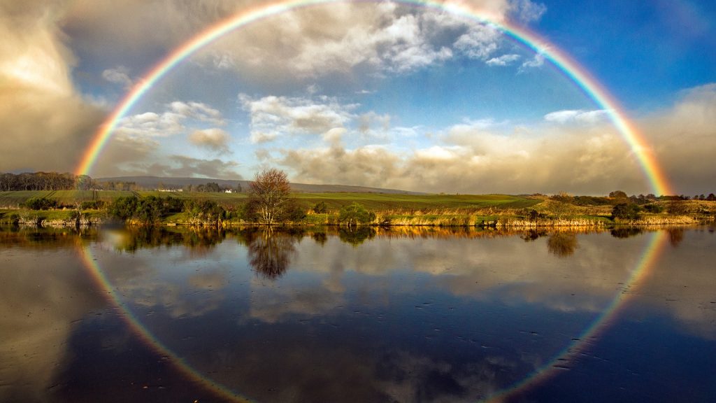 Rainbow over the Newmore Fisheries near Invergordon in the Scotland Highlands, Inverness, UK