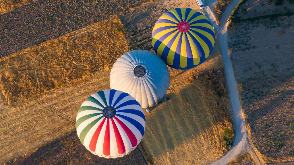 Aerial view of hot air balloons over landscape, Cappadocia, Turkey