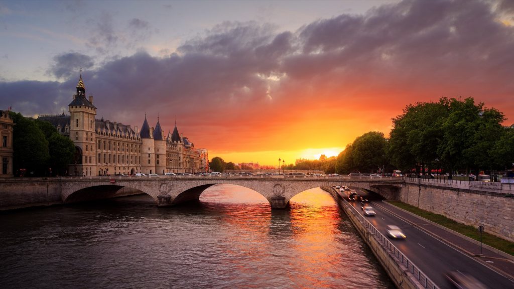 Sunset over "La Conciergerie" at Seine river in Paris, France