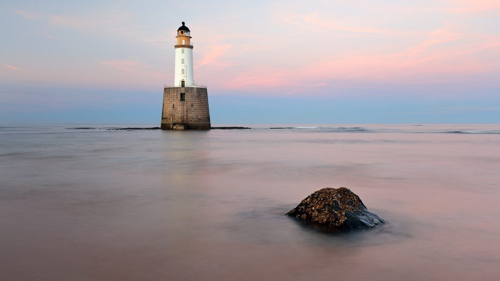 Sunset at Rattray Head Lighthouse on the north-east coast of Scotland, Aberdeenshire, UK