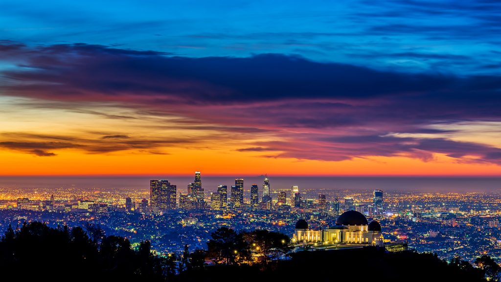 Downtown Los Angeles skyline and Griffith Park Observatory sunrise, California, USA